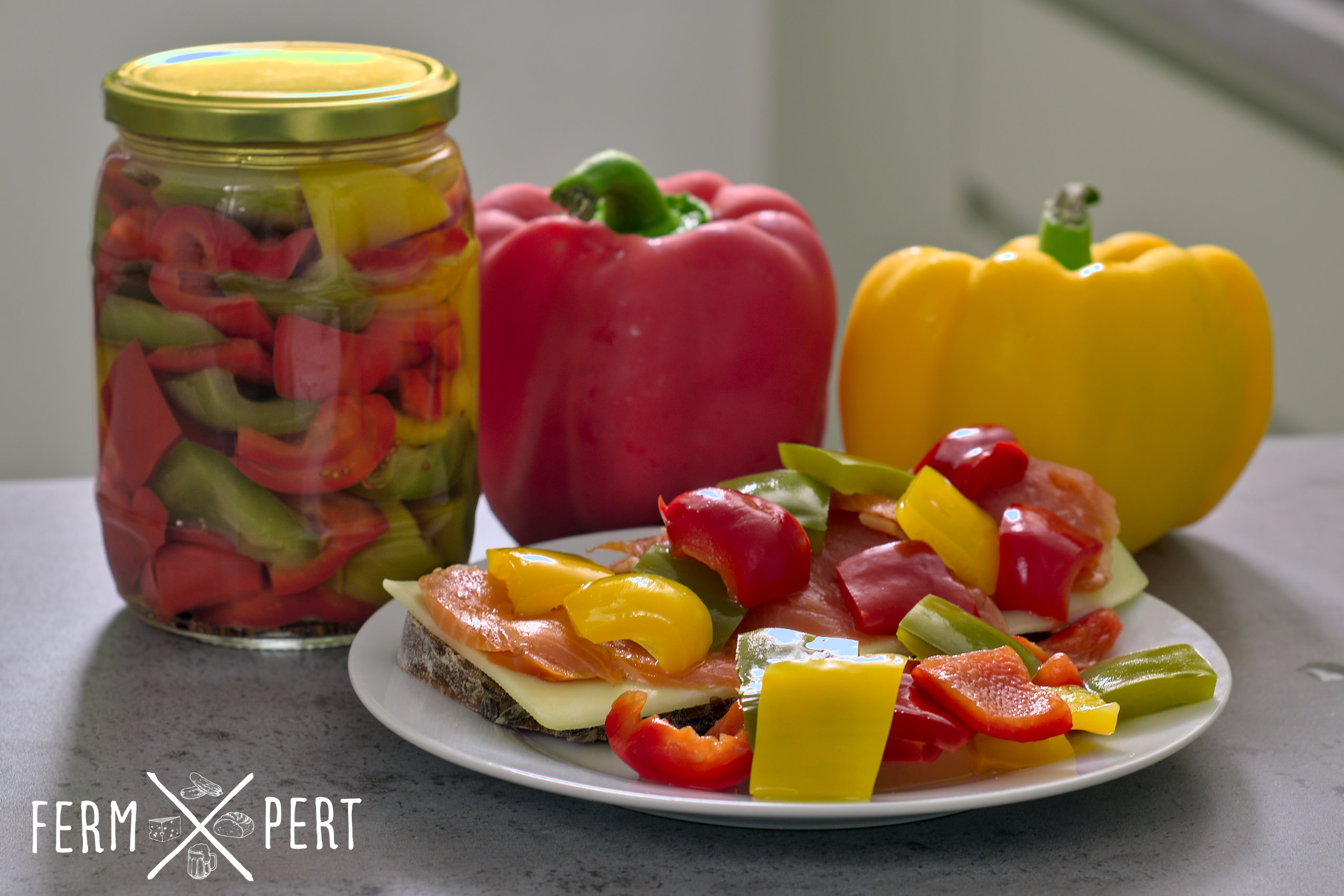 Photo of pickled peppers on a plate and in a jar.