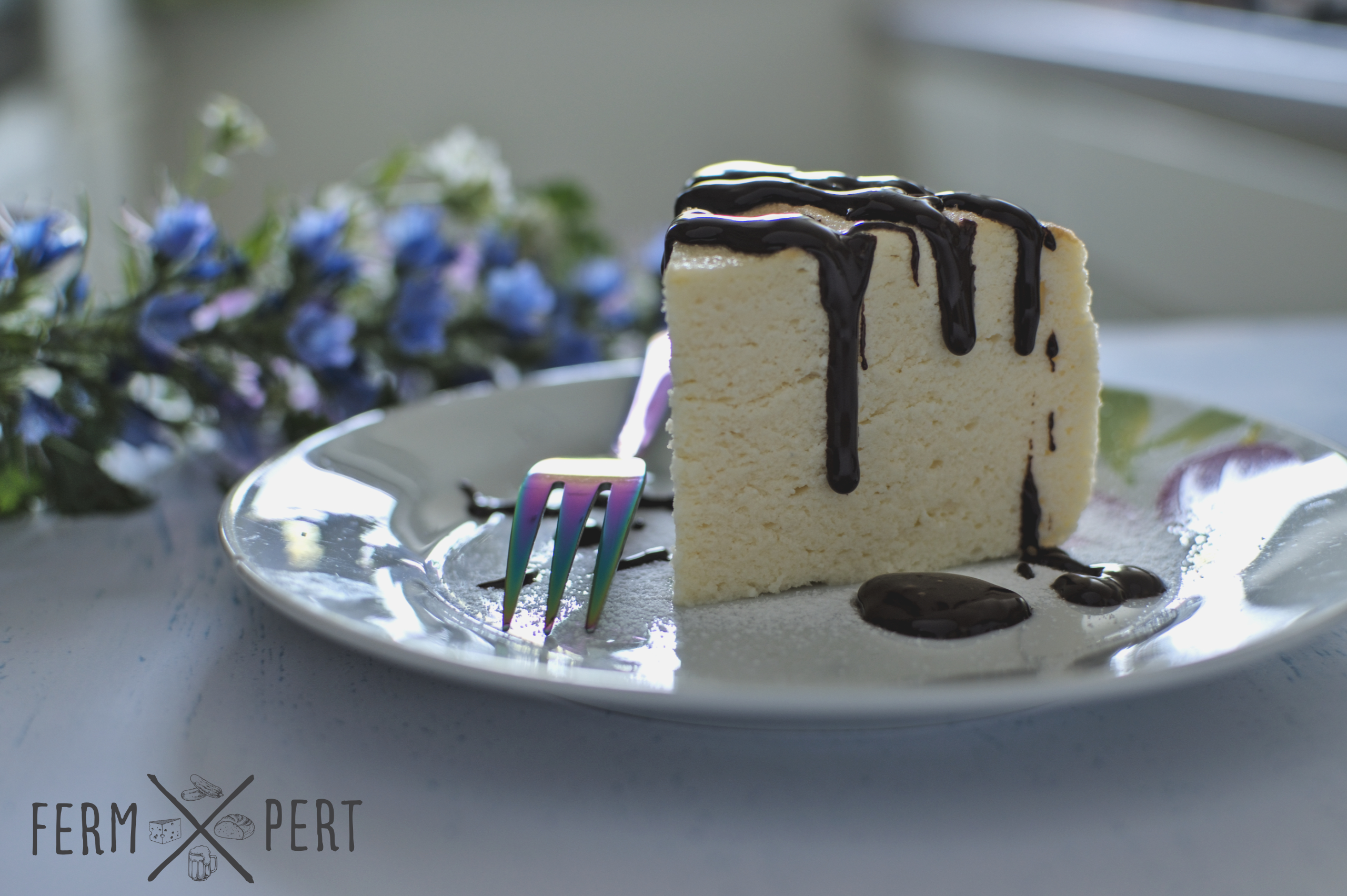 Photo of a slice of cheesecake with ganache